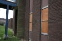 A view of the boarded up windows at the Long Term Conditions Centre