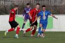 Romford's Finlay Dorrell on the ball at Coggeshall