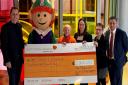 Mercury Centre presents cheque to Saint Francis Hospice