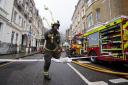 Body-worn camera footage of police officers running into a burning building has been released after a fire at a flat in south-west London left 13 people needing hospital treatment (James Manning/PA)