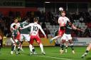 Carl Piergianni heads the ball for Stevenage against Bolton. Picture: TGS PHOTO