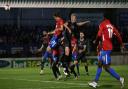 Matt Robinson of Dagenham and Redbridge goes close against Salford City in the FA Cup