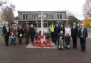 Police and musicians at the war memorial with councillors and other attendees. Nick Joseph is with his mother 103-year-old Mary Joseph.