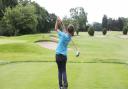 A youngster tees off at Romford Golf Club.