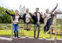 Jumping for joy after a new park with 2.5 hectares of green space and play areas was opened