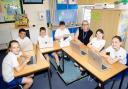 Pupils and headteacher Jo Savidge at Clockhouse Primary with laptops donated by TfL