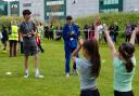 Students from Barking & Dagenham College put Rush Green Primary schoolchildren through their paces
