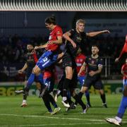 Matt Robinson of Dagenham and Redbridge goes close against Salford City in the FA Cup