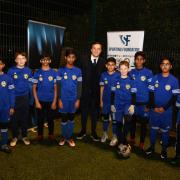 West Ham captain Mark Noble with players at the Sporting Bengal Academy in Stepney Green (pic: Ken Mears).