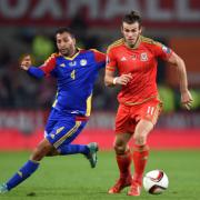 Wales' Gareth Bale and Andorra's Oscar Sonejee battle for the ball (pic: Empics)