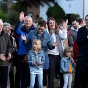 Spectators enjoying the music and build up to the Platinum Jubilee beacon-lighting ceremony on Havering-atte-Bower village green