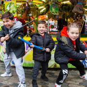 Tyler Kaynak, nine, Leo Kaynak, three, and Freddie Finch, nine, at the Christmas funfair.