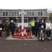 Police and musicians at the war memorial with councillors and other attendees. Nick Joseph is with his mother 103-year-old Mary Joseph.