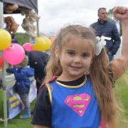 Five-year-old Jessica Cooper dressed up as superwoman for the dog show