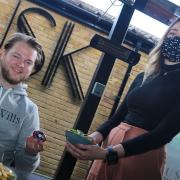 Customer Ryan Lane tries out the Table Tap technology with waitress Bertie Candon at Dusk Restaurant