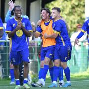 Romford players celebrate after their FA Cup win at Potters Bar Town