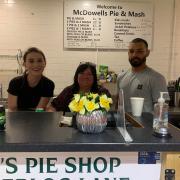 Linda McDowell, centre, the owner of McDowell's Pie & Mash, with staff and Joe (right) a customer of 20 years.