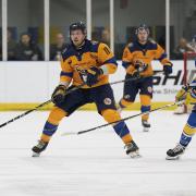 Raiders defenceman Tom Relf attacks against Leeds