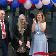 Cllr Maureen Worby cuts the ribbon to open the community hub with Cllr Tony Ramsay (Ieft) and college principal Natalie Davison