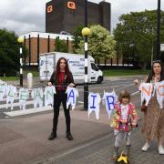L-R: Gina Must, Ruth Kettle-Frisby, Lydie Abessira Vinokur in North Street, Hornchurch with a 'Clean Air Now' message