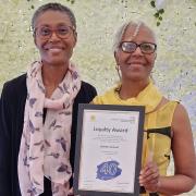 Juliette Samuel (right) with her long service award