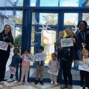 Monkey Puzzle staff and some of the children at the temporary location