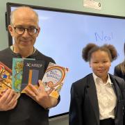 Poet Neal Zetter with pupils at Romford's Compass School