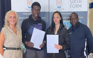 Busayo Williams and Simone Boyd, pupils at St Edward's Academy, with Ade Adewale (assistant headteacher) and Jodie Hassan (headteacher)