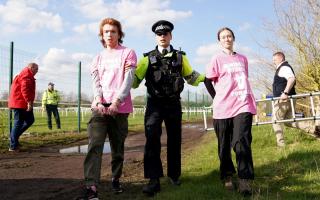 Activists being removed by police at Aintree Racecourse (Tim Goode/PA)