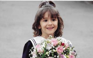 Kate Guthrie with flowers she presented to the Queen Mother