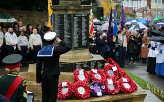 A sea cadet from Hornchurch and Upminster unit salutes at the Hornchurch War Memorial