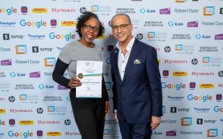 Nichole Goodison proudly recieving a 'Small Business Sunday' award from former Dragon Theo Paphitis last Friday (February 23)