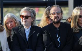 Sir Paul McCartney, left, and Sir Ringo Starr attend the Stella McCartney Fall/Winter 2024-2025 ready-to-wear collection (Vianney Le Caer/AP)