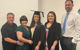 Amy Marren (centre), pictured with family members, has won an MBE for services to further education and apprenticeships