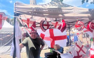 Jeffrey Dartford, a market seller in Romford Market, has a stall with products dedicated to the England football team