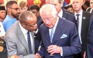 King Charles lends an ear to Queen’s Hospital consultant Prof Gideon Mlawa