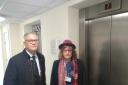 Judith Holt and Andrew Rosindell MP standing by a lift in Charrington Court