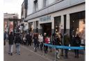 A queue of shoppers form outside Primark in Romford