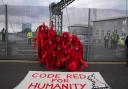 The Red Rebel Brigade stage a protest along the perimeter of the Cop26 summit