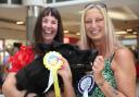 Winner of 'best in show' four-year-old German Shepherd Loki with owner Tracey Tallintire (left) and  judge Emma