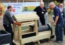 The wooden train being installed outside the Tesco superstore in Rainham