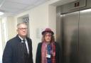 Judith Holt and Andrew Rosindell MP standing by a lift in Charrington Court