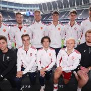 England and Wales hockey players face the camera at Tottenham Hotspur Stadium