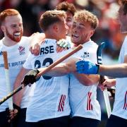 Great Britain celebrate a goal against India in the FIH Pro League