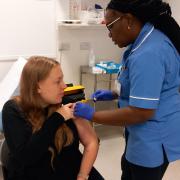 Natalie Haggis gets the vaccination from nurse Anne Opute at Queen's  antenatal clinic