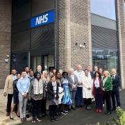 Guests at the official opening of Beam Park Health Centre gather outside the building along with GP partners from Beam Park Medical Practice and staff from North East London NHS Foundation Trust (NELFT)