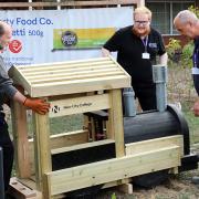 The wooden train being installed outside the Tesco superstore in Rainham