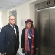 Judith Holt and Andrew Rosindell MP standing by a lift in Charrington Court