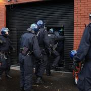 Police officers raided a property in the Dalmarnock area of Glasgow as part of the operation (Jane Barlow/PA)