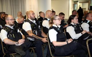 Officers are briefed ahead of the action day